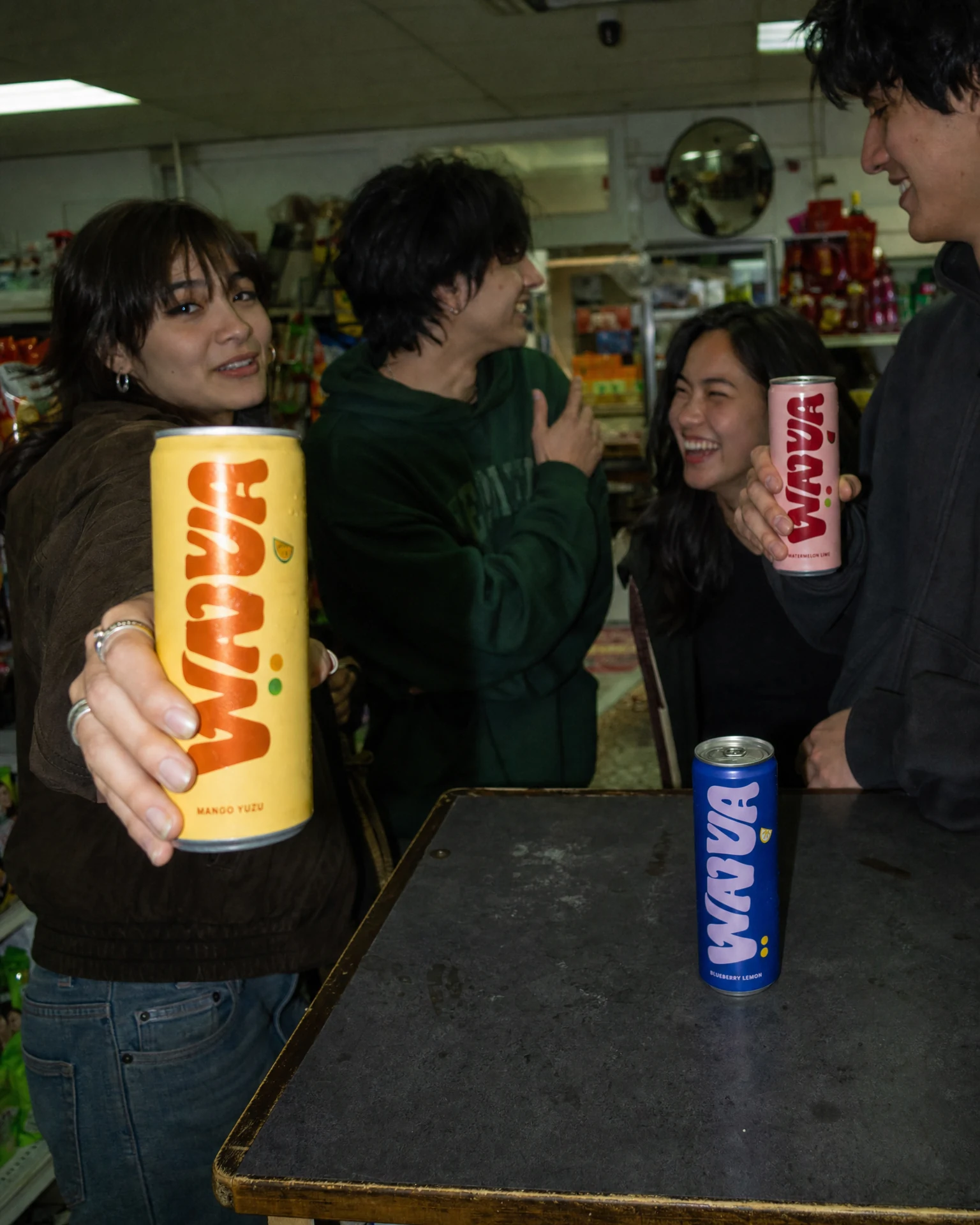 Friends photographed candidly inside a convenience store with Wavva
